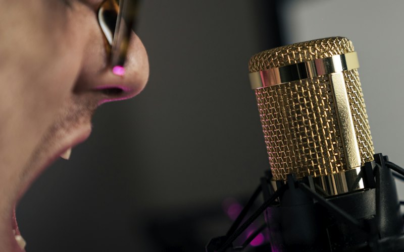 A person speaking into a microphone